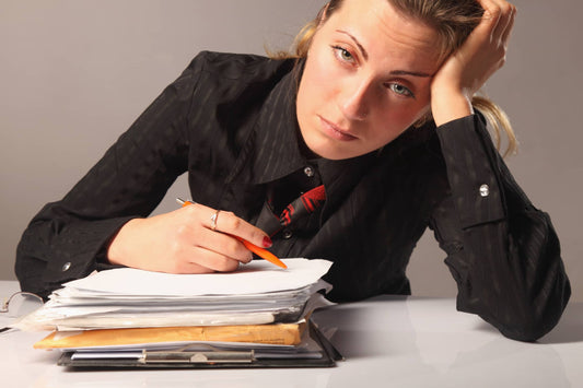 Weary woman working on dissertation
