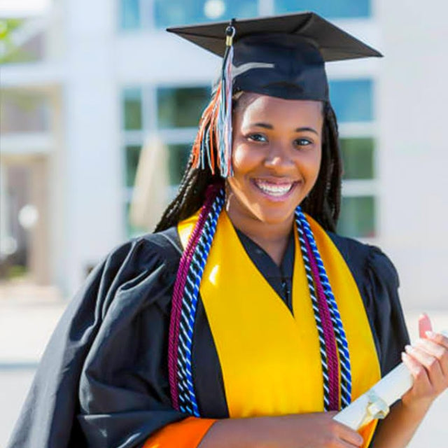 Student holding rolled diploma